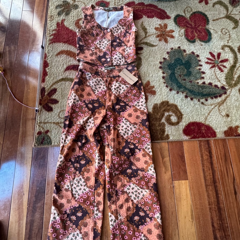 Pants and matching vest. Pants have tag but vest does not. Brand new.